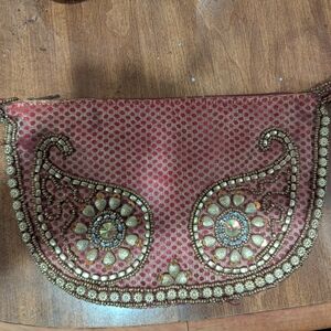 Elegant Red Crescent Wristlet with Turquoise Accents